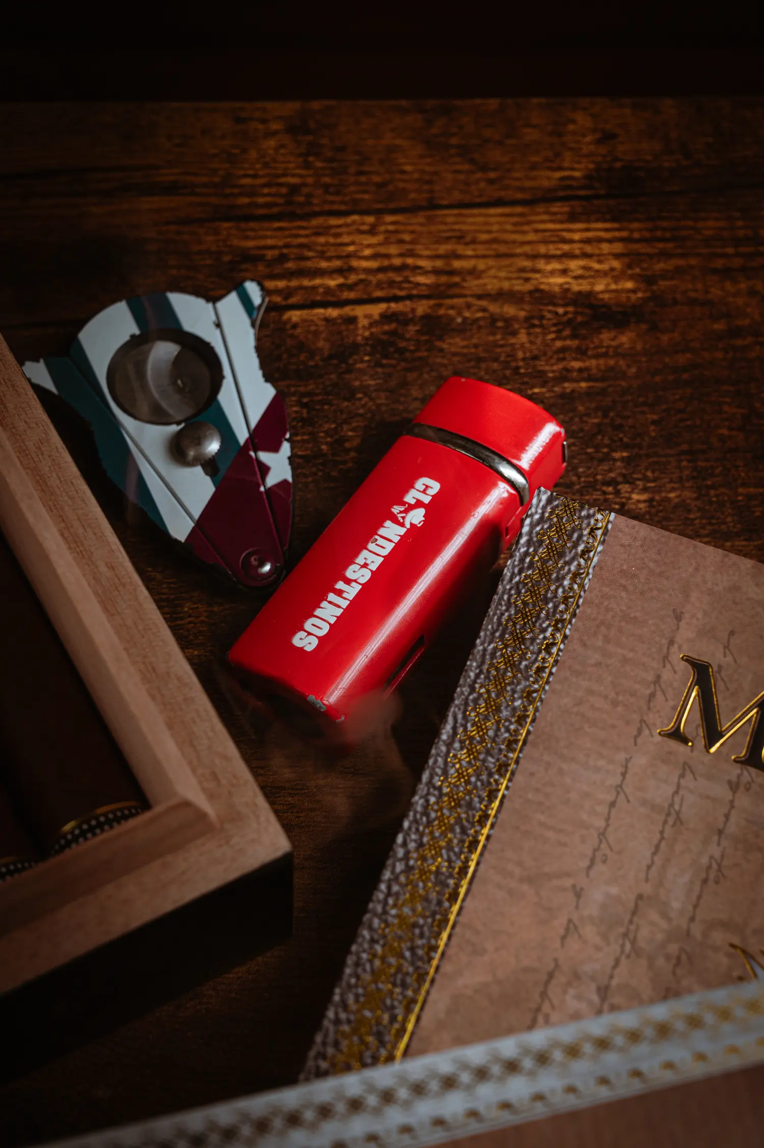 Red Clandestinos lighter, cigar cutter and a Místico cigar box